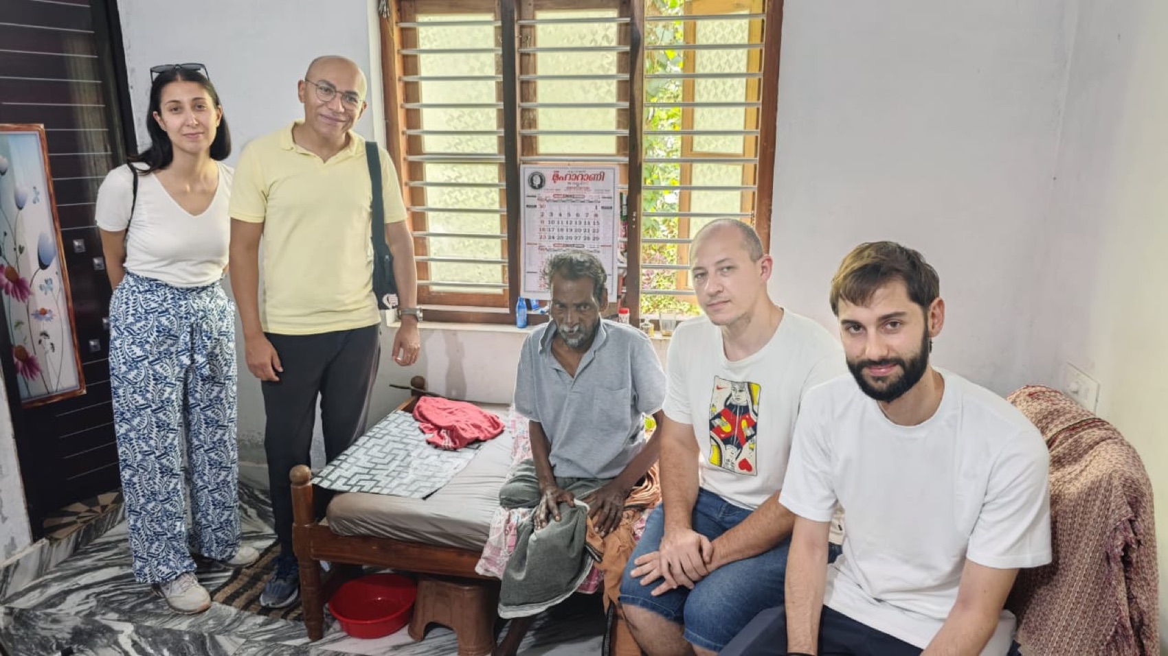 Sitting with an elder in his home