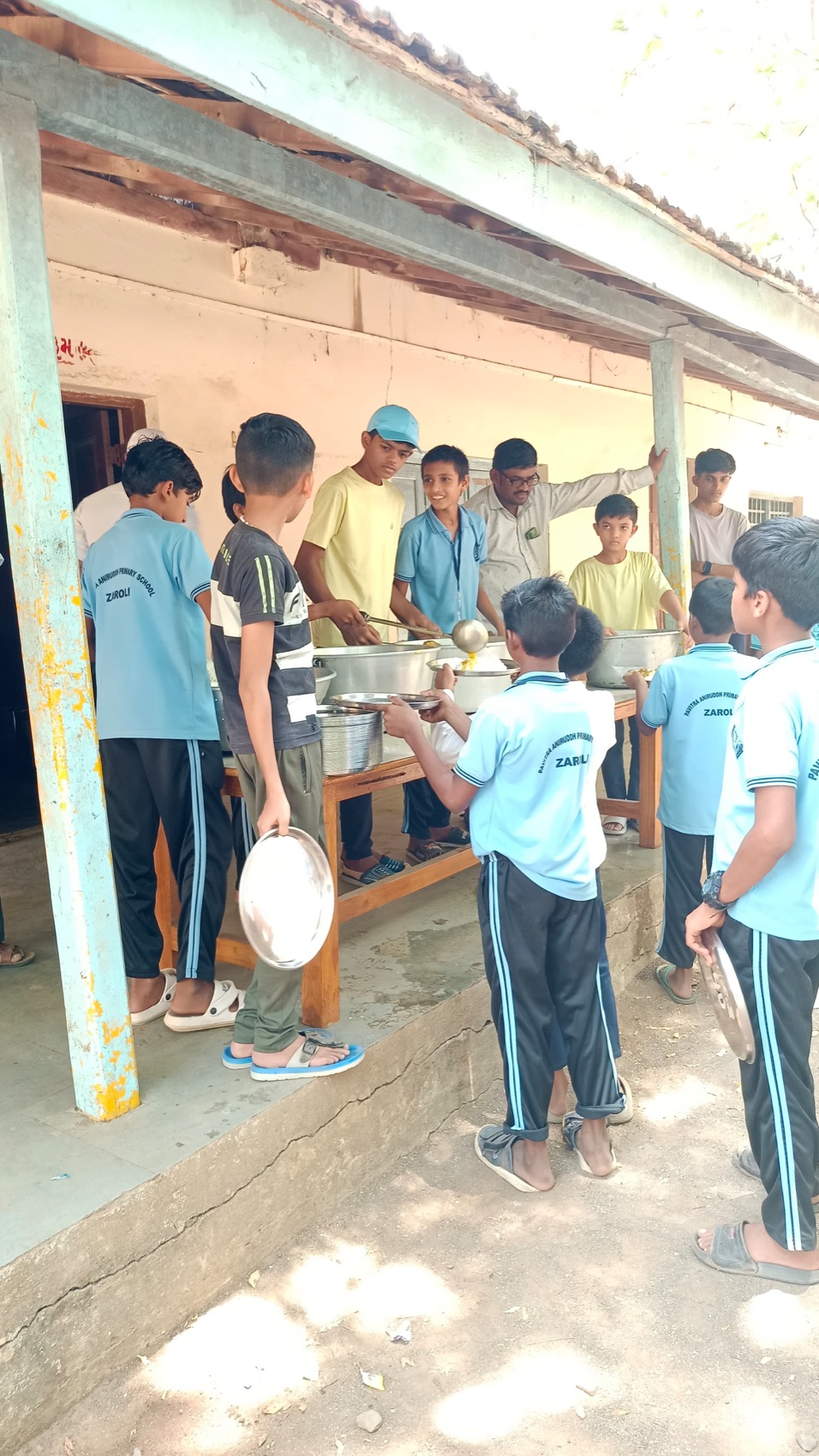 Youth volunteers serve the meal