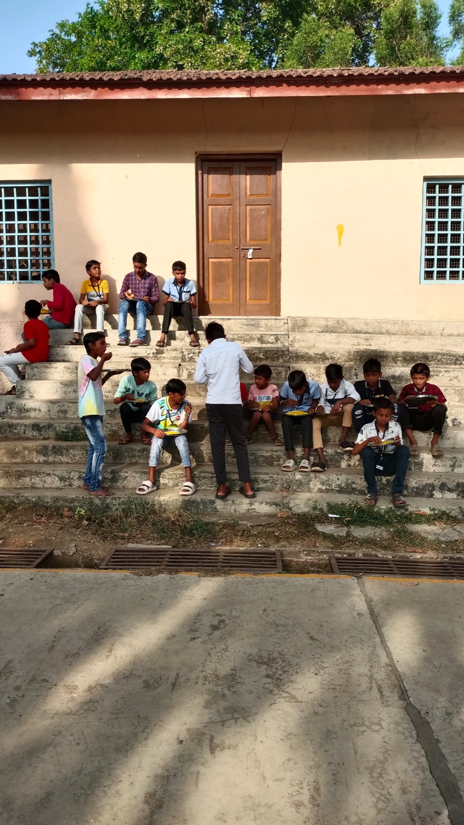 Children gather outside the centre